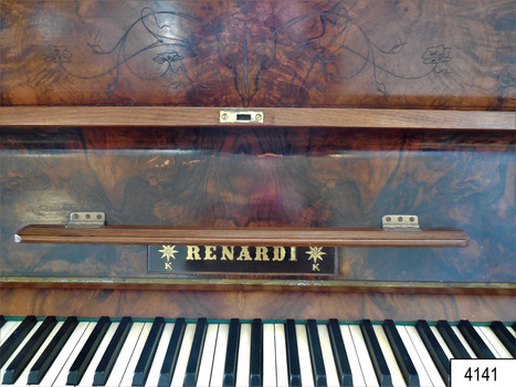 Maker's name 'RENARDI' in gold lettering with two decorative gold star motifs on both left and right sides. Ledge is supported by two brass hinges. Decorative etching detail is displayed on the front panel.