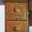 Drawers have decorative carving of branches