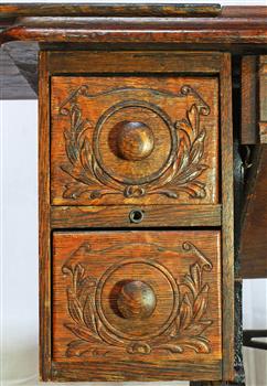 Drawers have decorative carving of branches