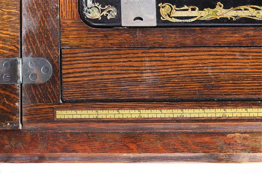 Rule is across the front of the machine's cabinet