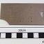 Shuttle cover plate has stamped inscriptions