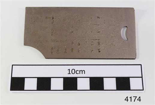 Shuttle cover plate has stamped inscriptions