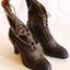 Ladies' brown leather calf length boots with lacing up to the top.