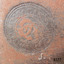 Label impressed into sole of boot, concentric circles with text between, logo in circle's centre