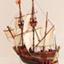 Wooden ship model with three masts and flying two flags