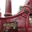 Details are cast into the metal, possibly representing the size or ratio of the mechanical movement