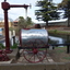 Pump in front of standpipe and beside the Furphy water cart into which the water flows