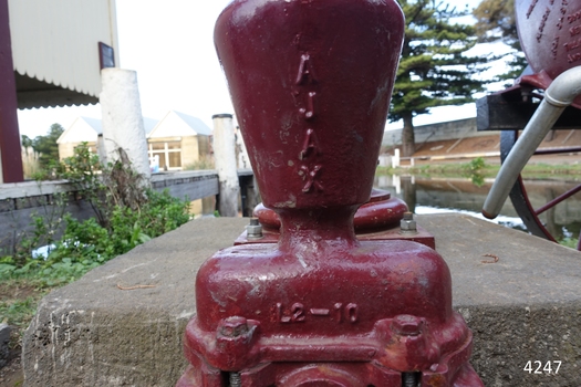 Model AJAX cast into metal, along with other alpha-numeric details, possibly relating to the power ratio