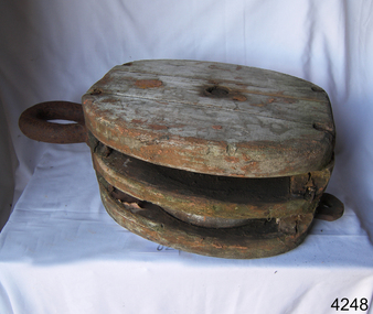 Wooden two-sheave block with metal sheaves, becket and straps