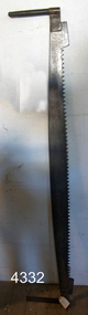 Upright heavy duty timber saw with wide long blade and large teeth