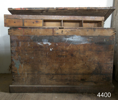 Toolbox with lit open and tray resting across the top edges of the open base