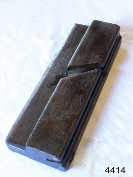 Wooden plane has stamped inscription on one end
