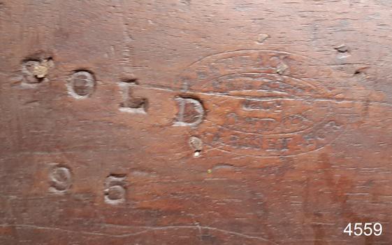 Figures and oval borders stamped on timber