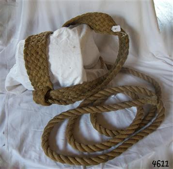Barrel sling is made of rope and displayed over an object