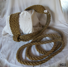 Barrel sling is made of rope and displayed over an object