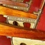 Maker's name is inscribed on each seat's armrest bracket