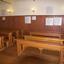 Made from solid wood in a simple design. Each desk and bench seats four students. Four inkwells on each desk.