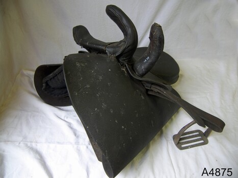 Leather side saddle with accessories, worn by women when riding