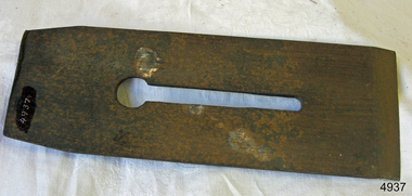 Rectangular metal with keyhole oval cutout and inscription