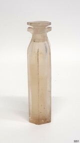 Opaque hexagonal glass bottle with glass stopper