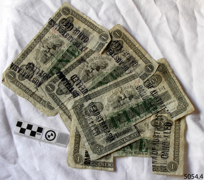 Four banknotes fanned out on a table. Three are three one-pound and one is five-pound notes.