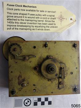 Brass mechanism with working parts, information above it