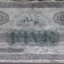 Banknote is overprinted with the serial number and denomination