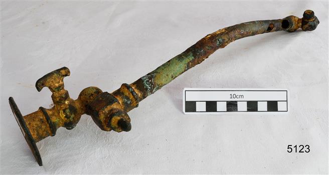 Metal pipe with a tap fitting attached