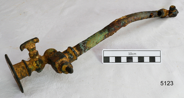 Metal pipe with a tap fitting attached