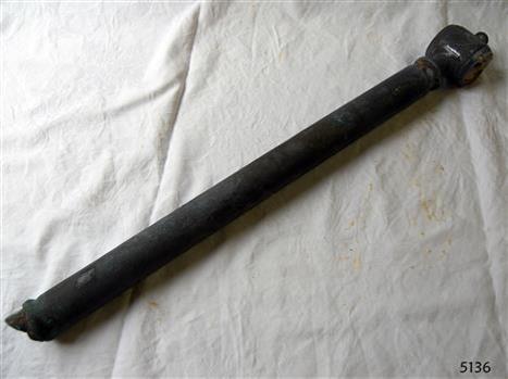 The long pipe has a broken jagged edge