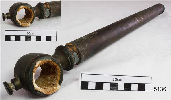Metal pipe has an open circular fitting attached