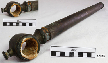 Metal pipe has an open circular fitting attached