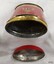 Oval base and domed oval lid, both showing signs of wear