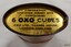 Base is gold coloured with black printed text