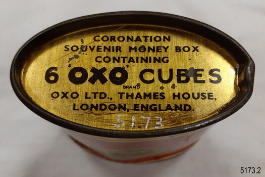 Base is gold coloured with black printed text