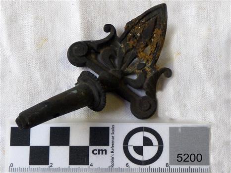 Metal gas tap with fancy iron work at the end