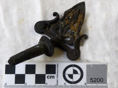 Metal gas tap with fancy iron work at the end