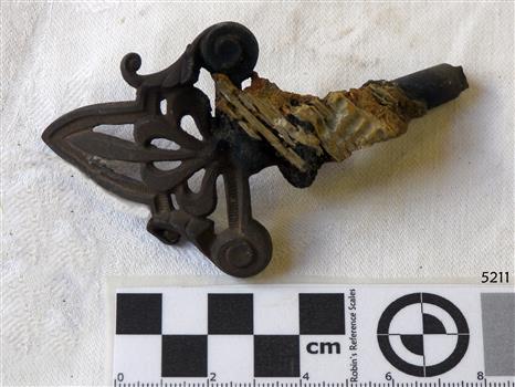 Fancy metalwork on gas tap end, with concretion attached