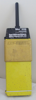 Yellow case has stamped brand across it. The top has a black panel with handwritten information