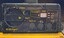 Black panel with labelled dials, lights and buttons