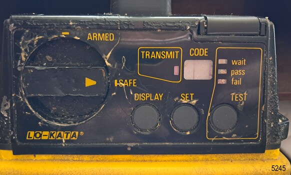 Black panel with labelled dials, lights and buttons
