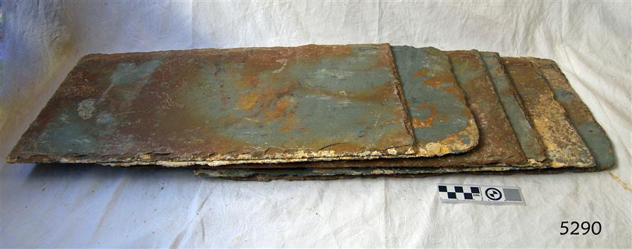 Rectangular tiles are coloured from grey, blue-grey to brown and red-brown