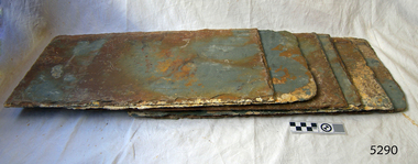 Rectangular tiles are coloured from grey, blue-grey to brown and red-brown