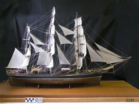 Model of rigged ship Cutty Sarkm mounted on timber