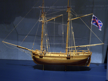 Wooden ship model with two masts, no sails attached