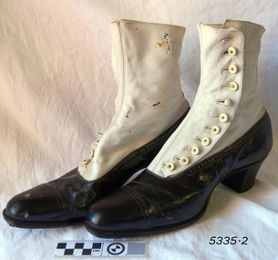 Pair of two-toned black and white button-up ladies' boots