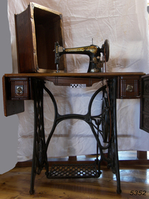 Wood and metal treadle sewing machine and table
