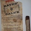Wrapper with instructions for use and stick of salve with small piece of wrapper around it.