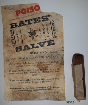 Wrapper with instructions for use and stick of salve with small piece of wrapper around it.