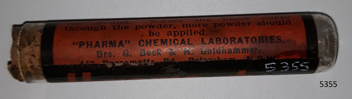 Glass container or vial with contents and cork, and label named Haemostop.